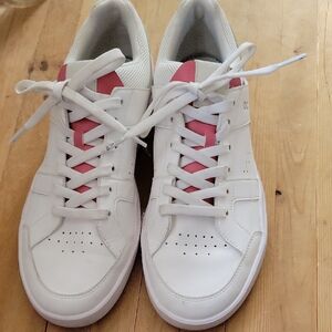 On White Sneakers with Pink Accents